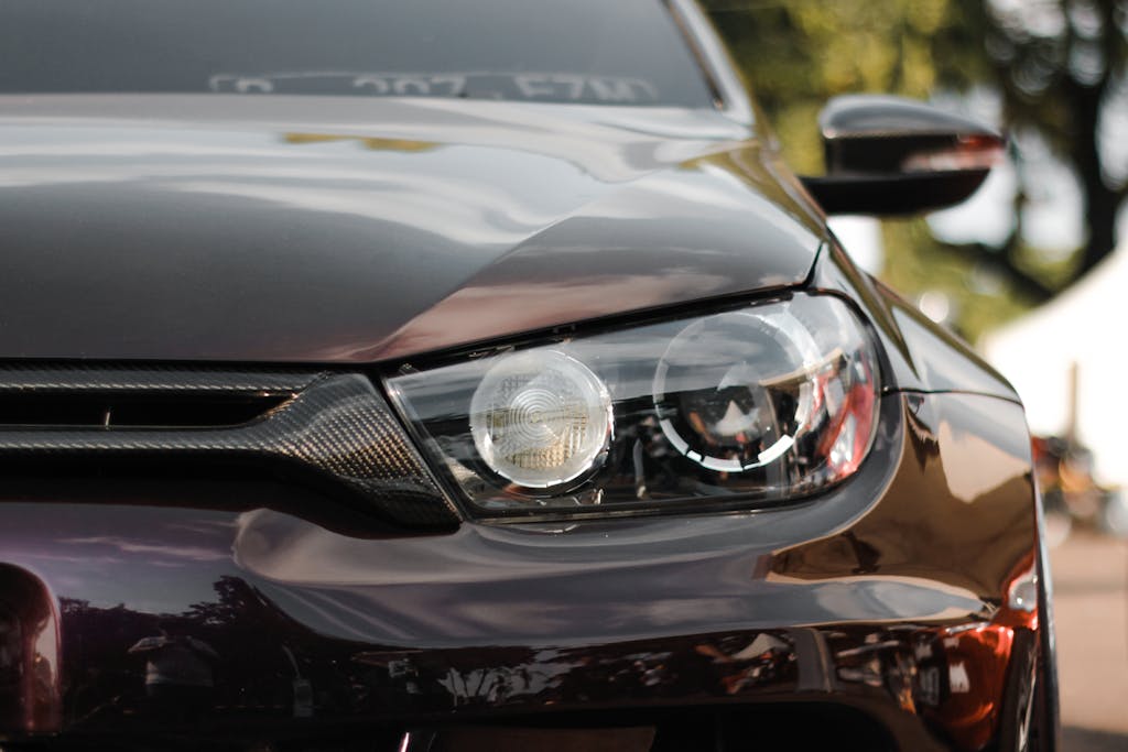 A sleek close-up of a modern car headlight showcasing design and style.